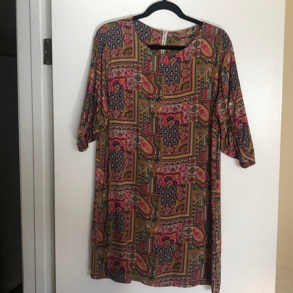 Tunic dress. 3/4 sleeves with button detail.